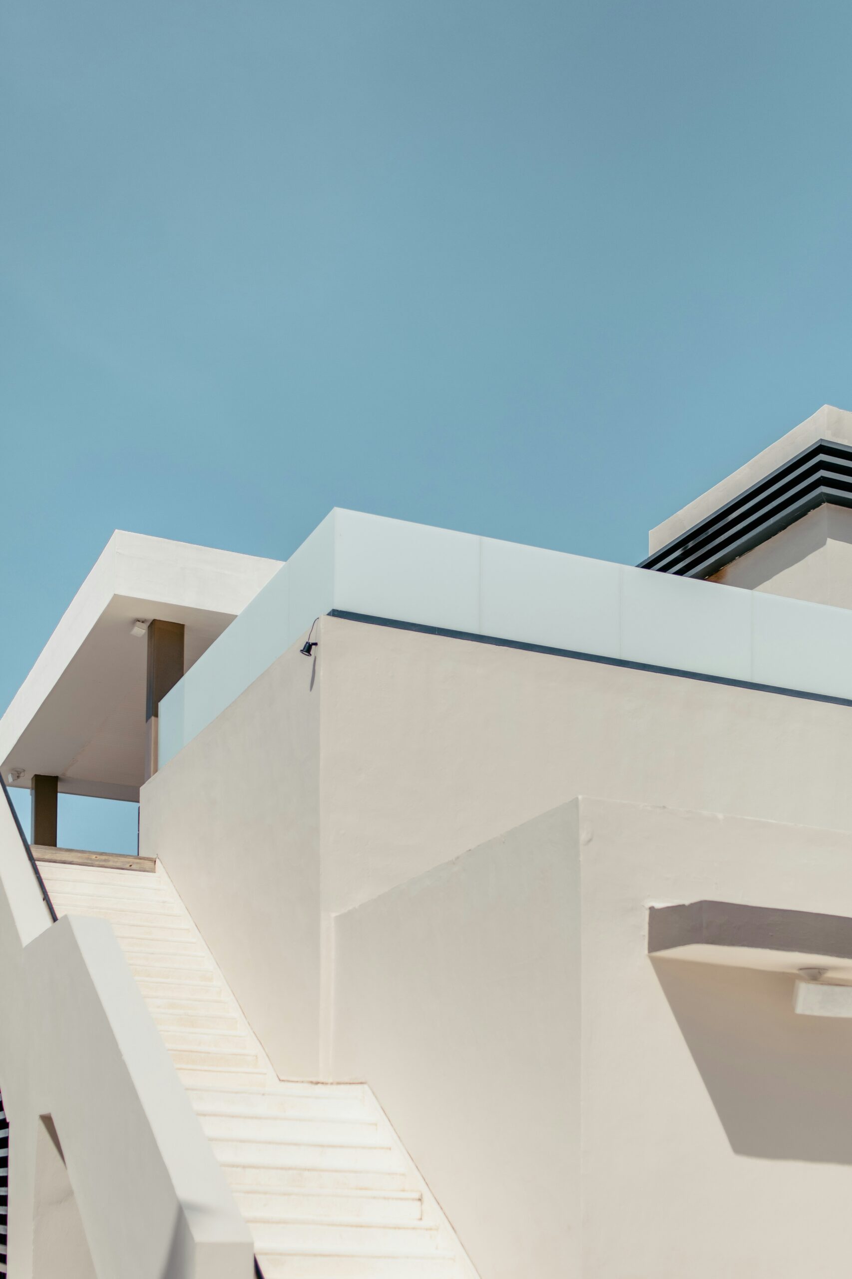 white concrete building under blue sky during daytime